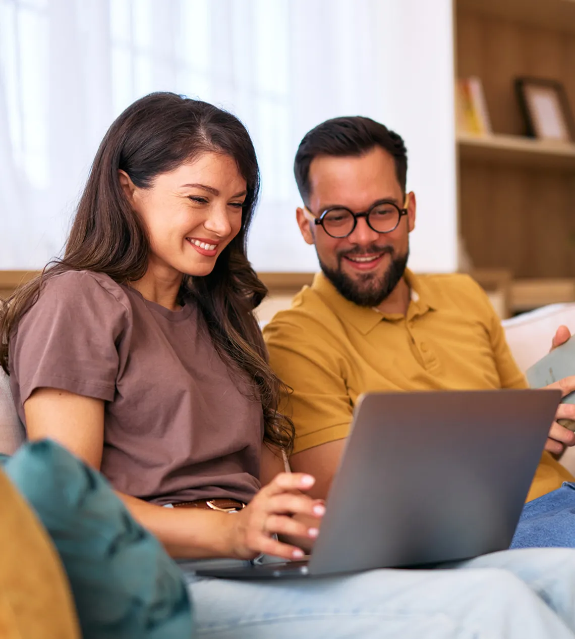 A couple looking at mortgage options on a laptop